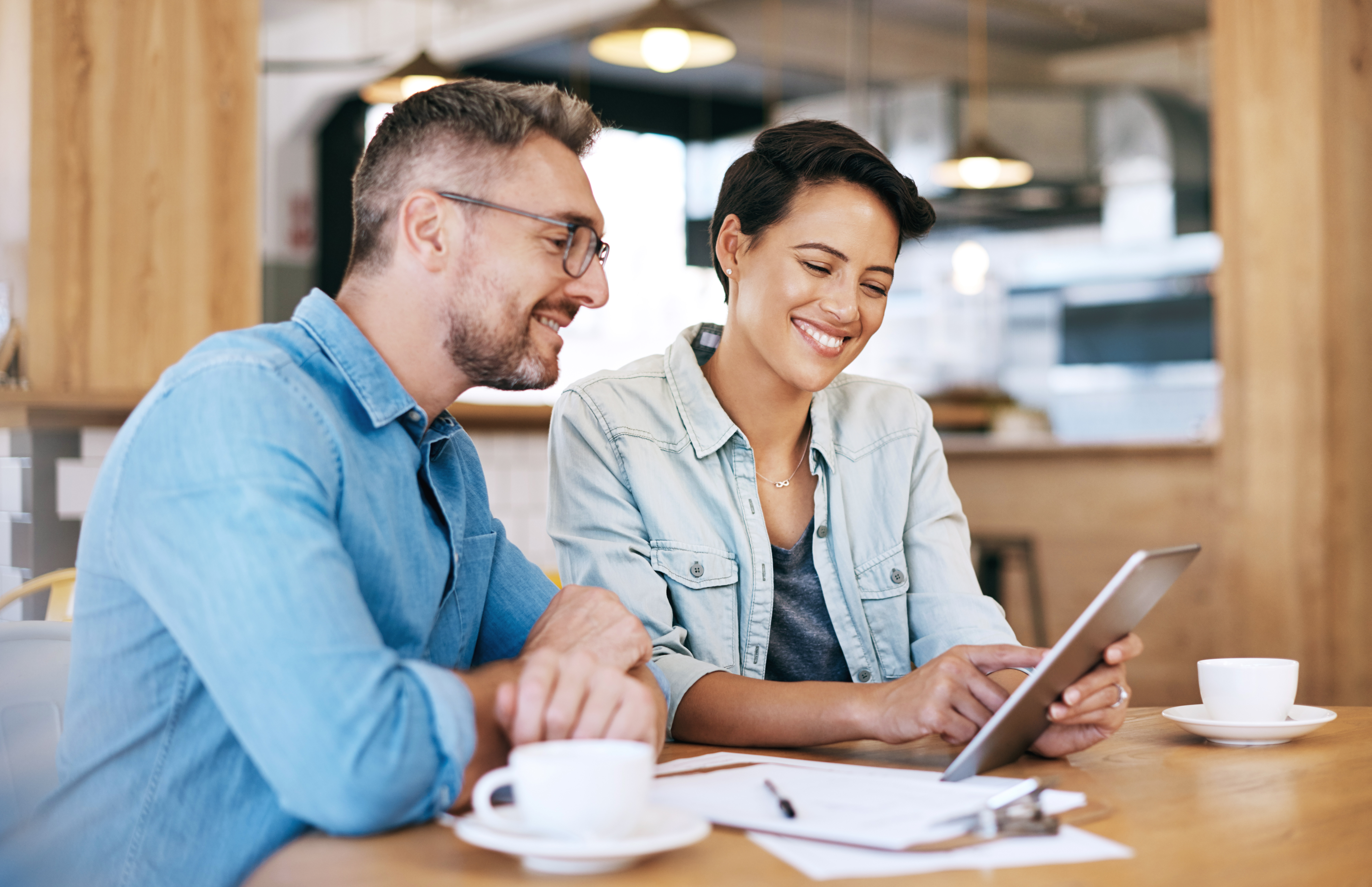Two business owners looking at a tablet