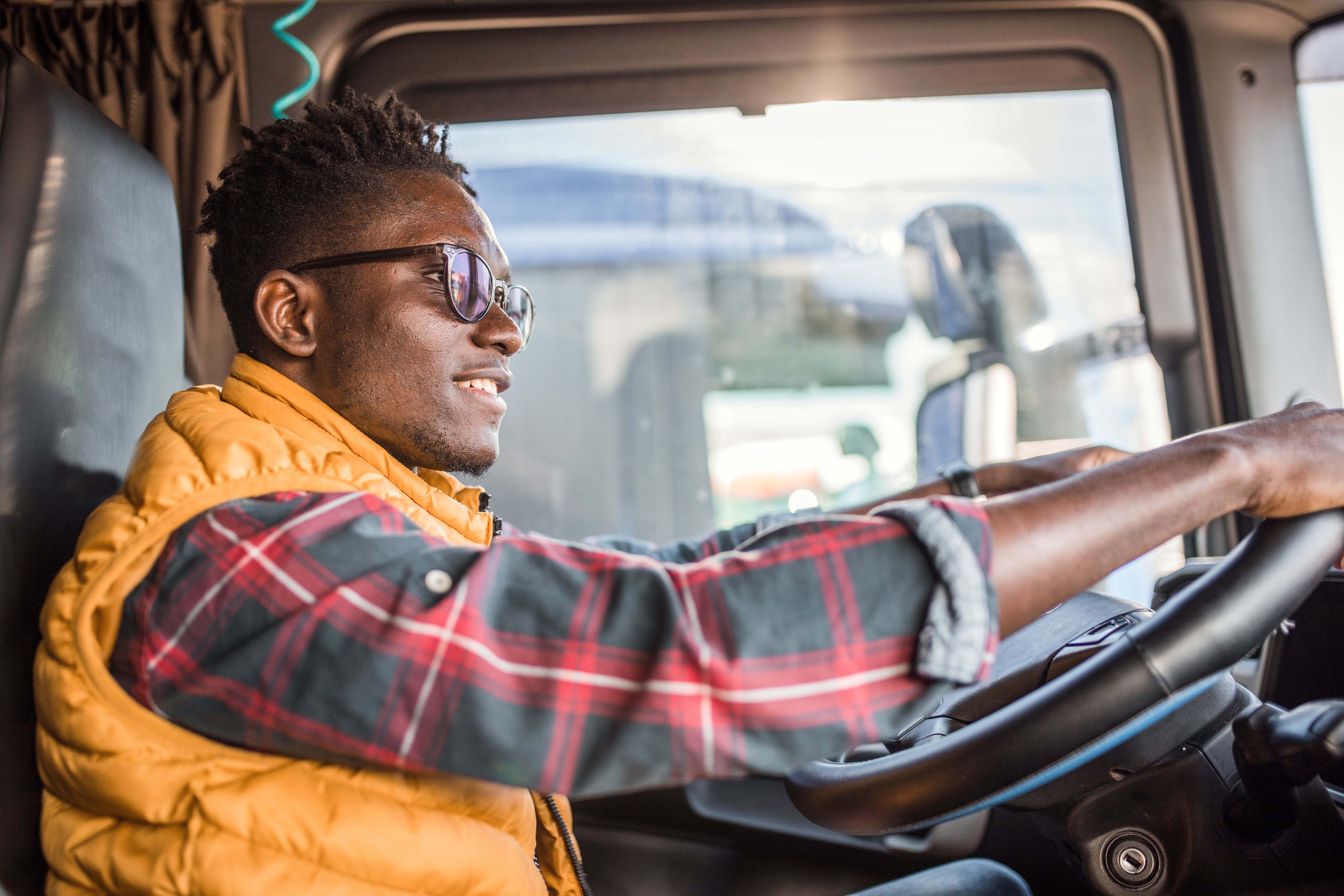 Truck driver uses steering wheel