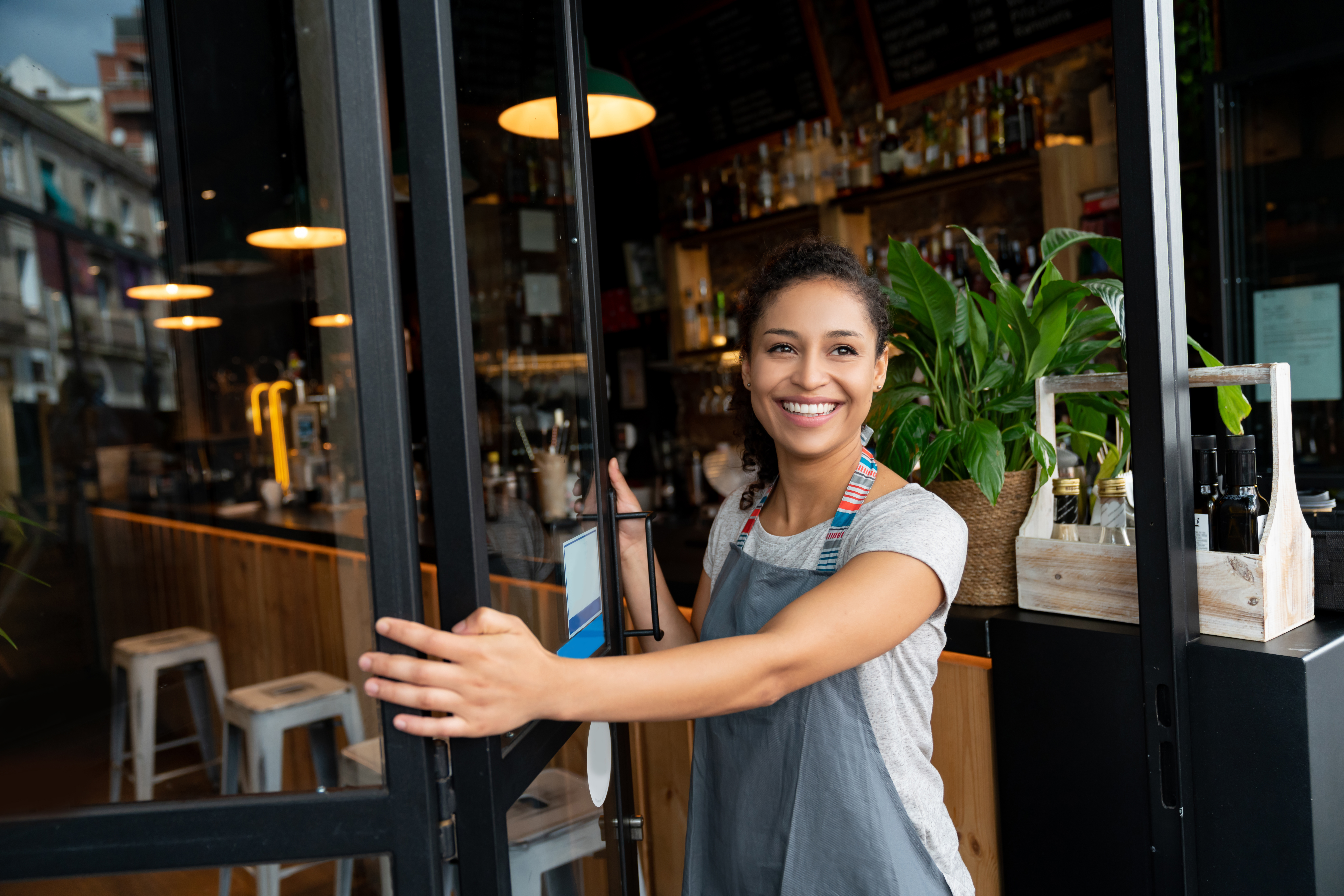 woman with apron on and smiling